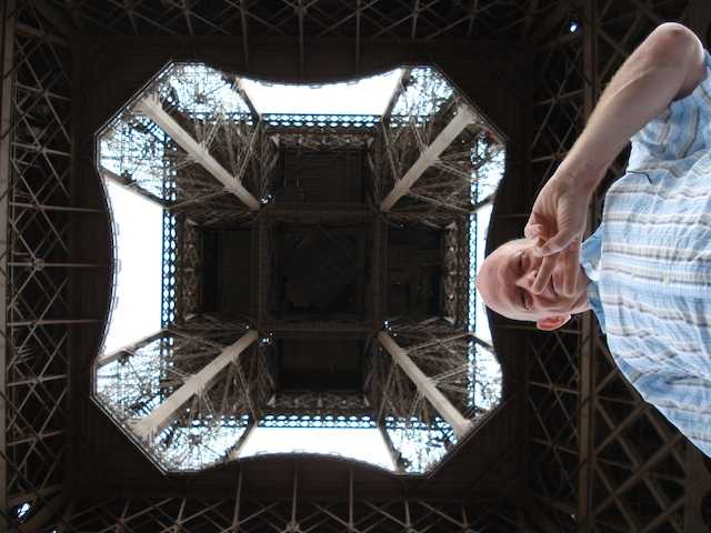 Standing beneath the Eiffel Tower